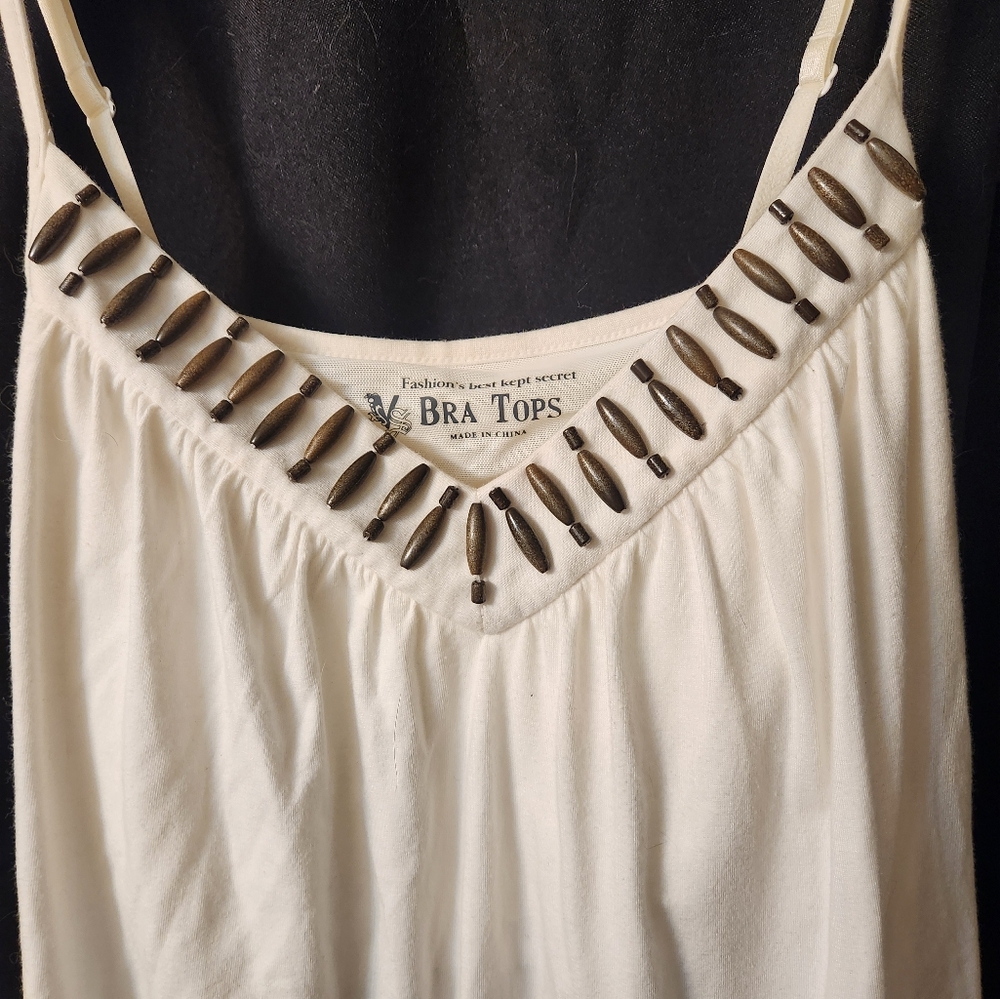 White sundress with beadwork around neckline & ties in the back